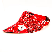 Load image into Gallery viewer, Side view of Classic red bandana print over-the-collar bandana put on a dog collar.  Has classic bandana pattern with black and white dogs and white bones.  Displayed on a white background. 
