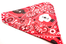 Load image into Gallery viewer, Close up angled view of Classic red bandana print over-the-collar bandana.  Has classic bandana pattern with black and white dogs and white bones.  Displayed on a white background. 
