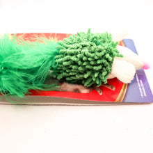 Load image into Gallery viewer, Side view on card tag of green Feather tailed hedgehog stuffed catnip cat toy. 
