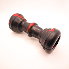 Load image into Gallery viewer, Angled view picture of Dogzilla Strong Chewer Bone dog toy.  Bone is hard black rubber with red accents.  Displayed on a white background. 
