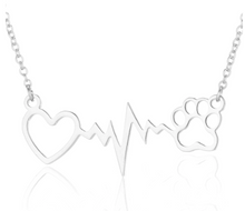 Load image into Gallery viewer, Silver necklace with open heart, heartbeat rhythm, and open pet paw. 
