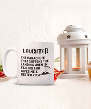 Load image into Gallery viewer, Laughter is a Parachute - It Softens the Landing Mug
